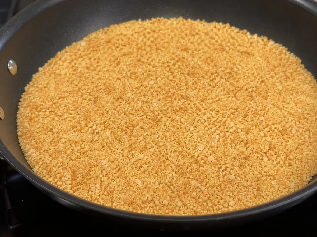 Evenly golden butter-toasted breadcrumbs for Austrian apple strudel