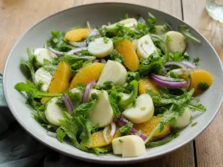 Brazilian hearts of palm and orange salad with arugula and red onion