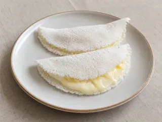 Folded Brazilian tapioca crepes filled with melted cheese