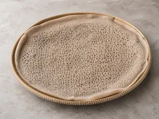 Stack of soft Ethiopian injera with a porous surface