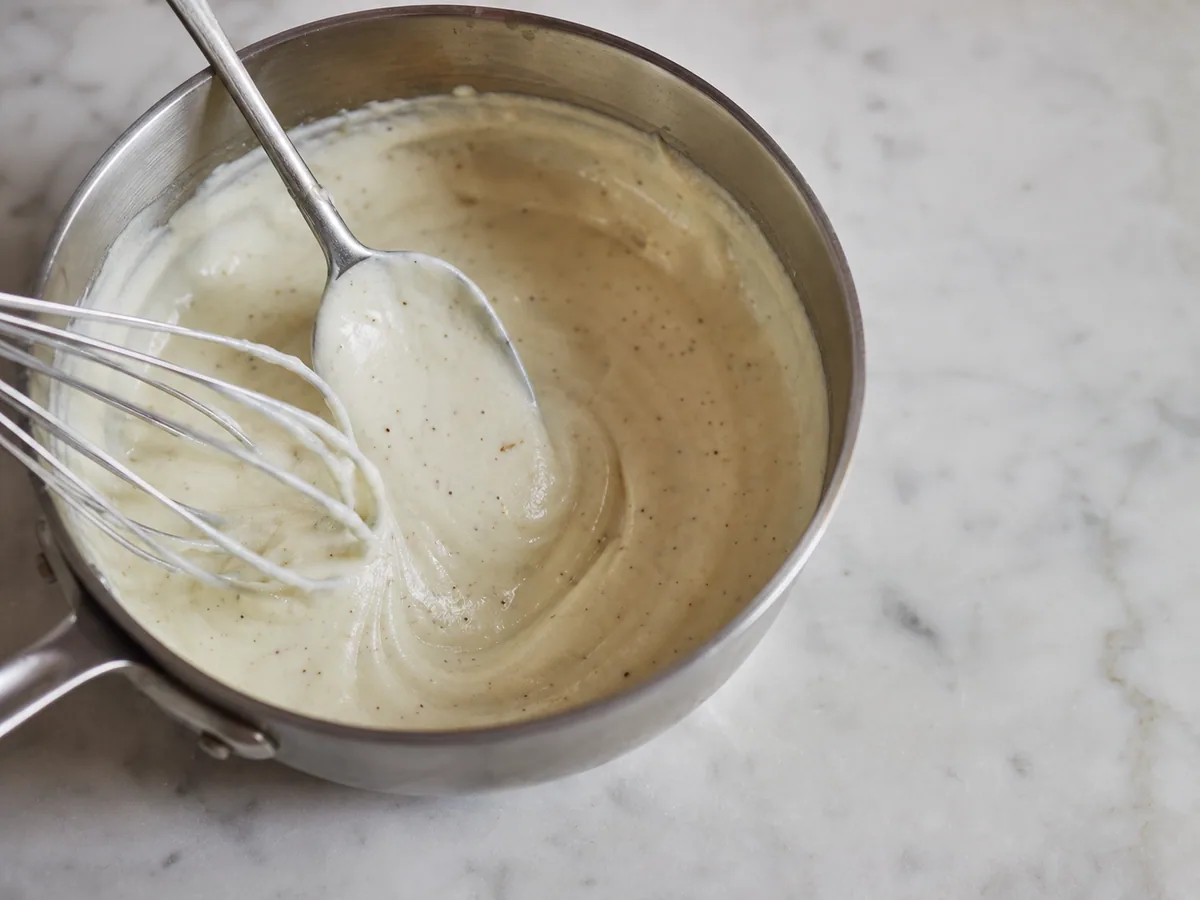 Smooth thick-ribbon béchamel for French croque madame