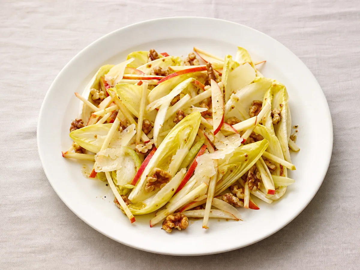 French endive salad with apple, toasted walnuts, and shaved Comté