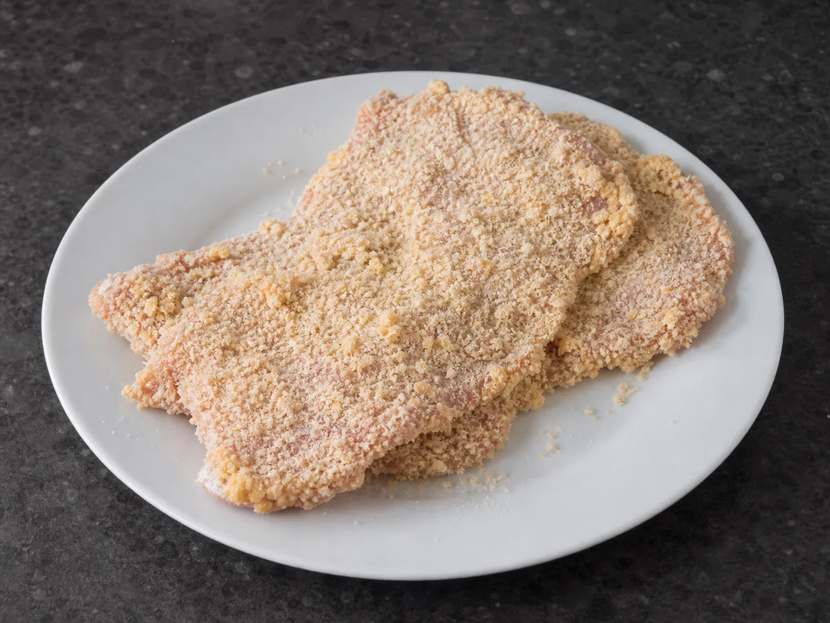 German Pork Schnitzel: Bread the pork lightly