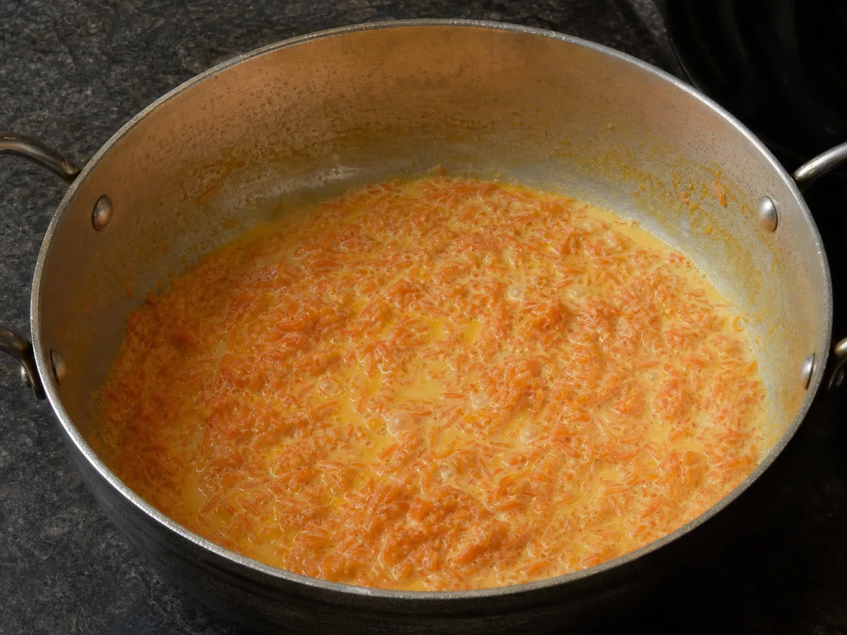 Tender grated carrots with only a little thick milk remaining for Indian carrot halwa