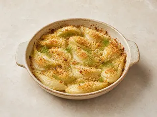 Golden baked fennel wedges with a crisp Parmesan breadcrumb topping
