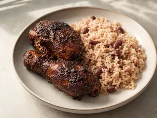 Jamaican jerk chicken served with coconut rice and red kidney beans