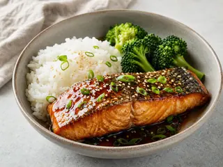 Japanese-inspired salmon teriyaki with steamed rice and broccoli