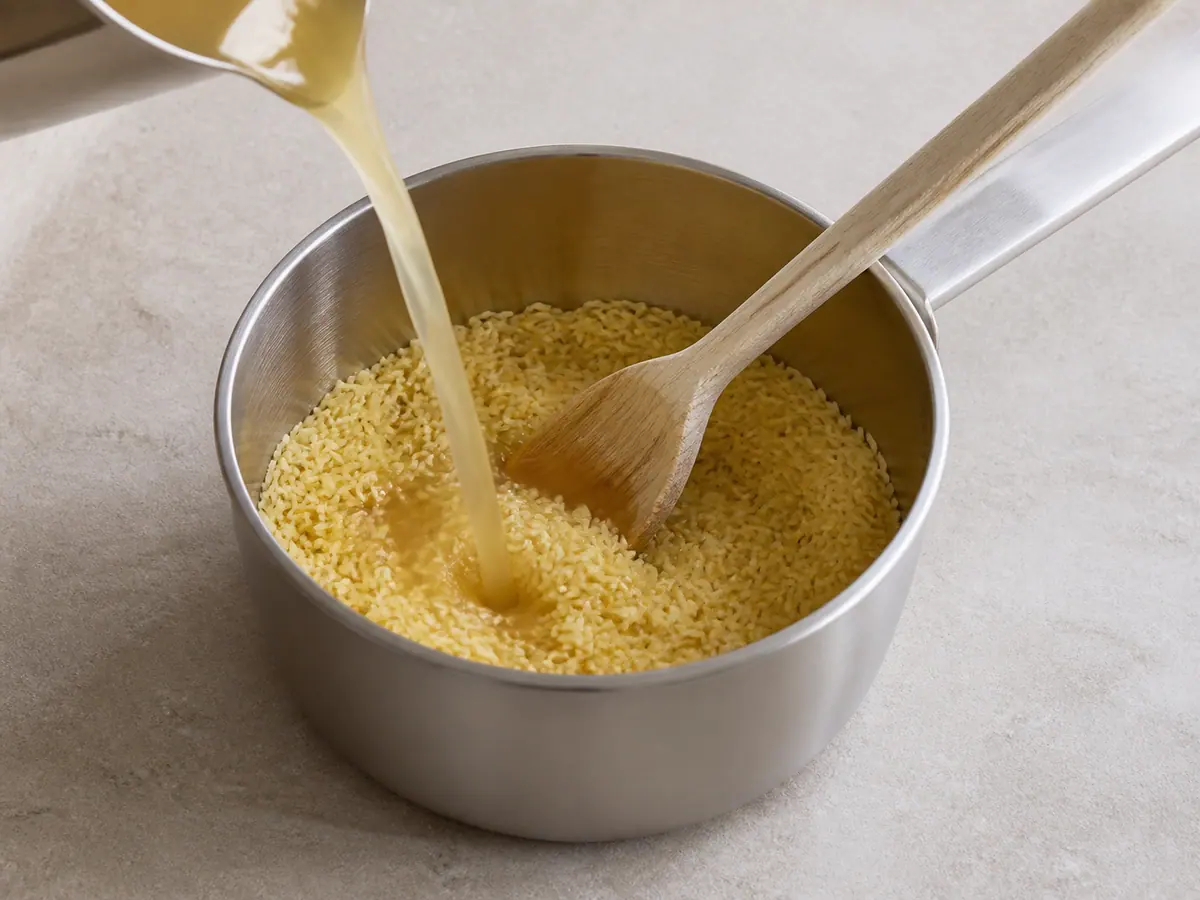 Cook the rice in the chicken broth