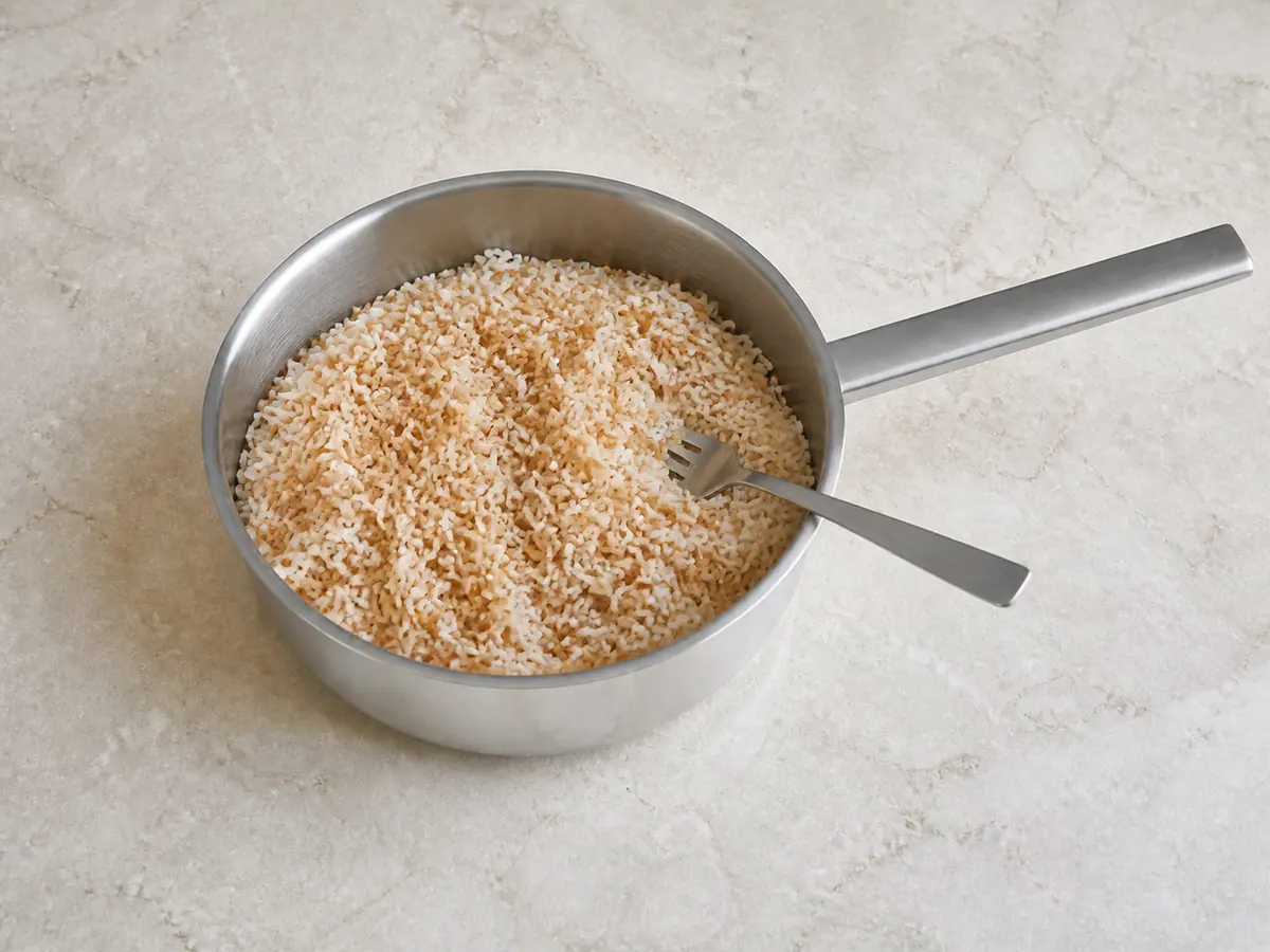 Fluffy Lebanese vermicelli rice loosened with a fork after resting