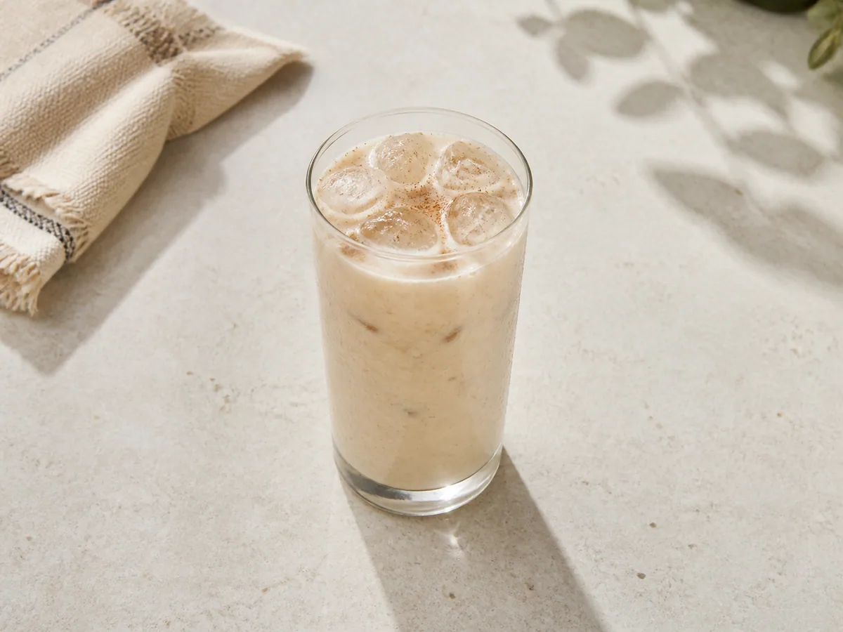 Glass of pale Mexican cinnamon horchata served over ice