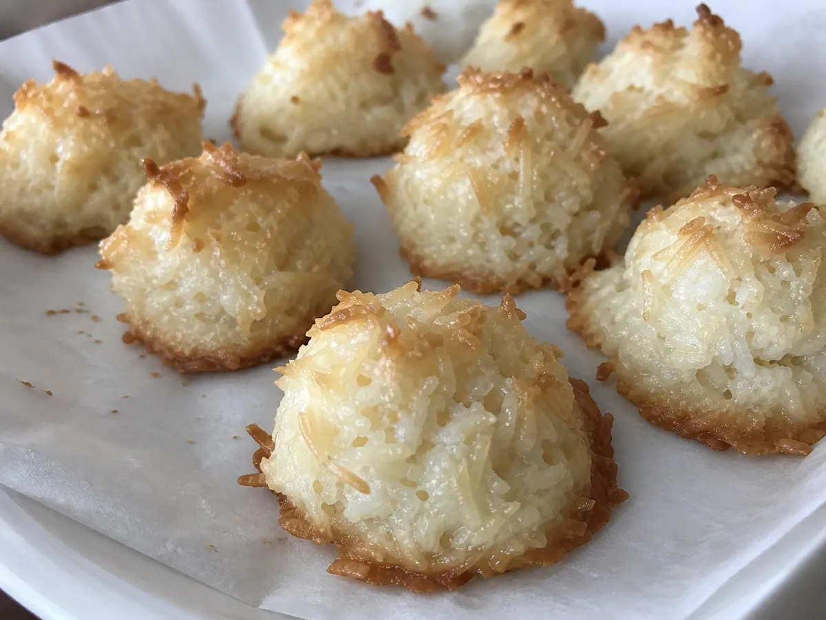 Golden Mexican coconut cocadas arranged on a ceramic plate