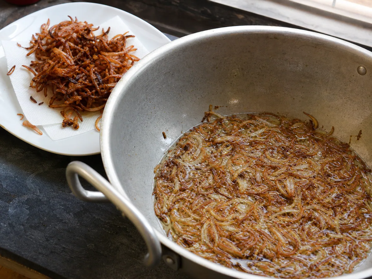 Deep-golden onions with crisp edges for Pakistani beef and lentil haleem