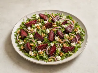 Roasted beet salad with arugula, goat cheese, and toasted walnuts