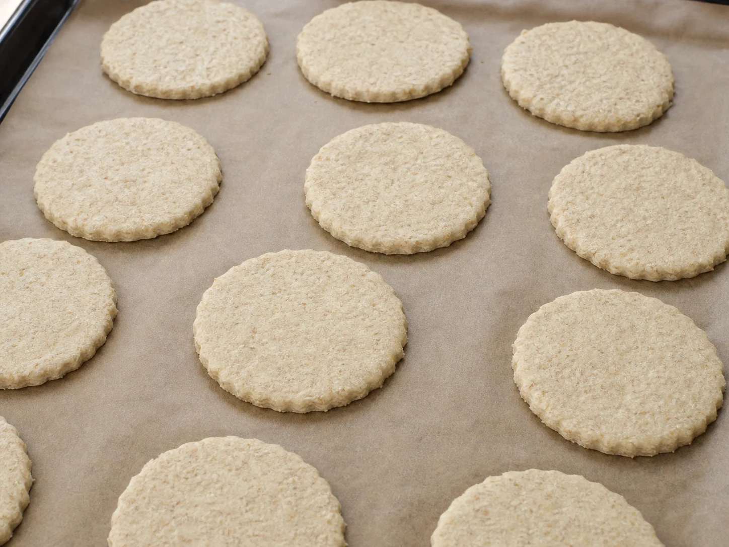 Pale Scottish oatcakes with dry matte tops after the first bake