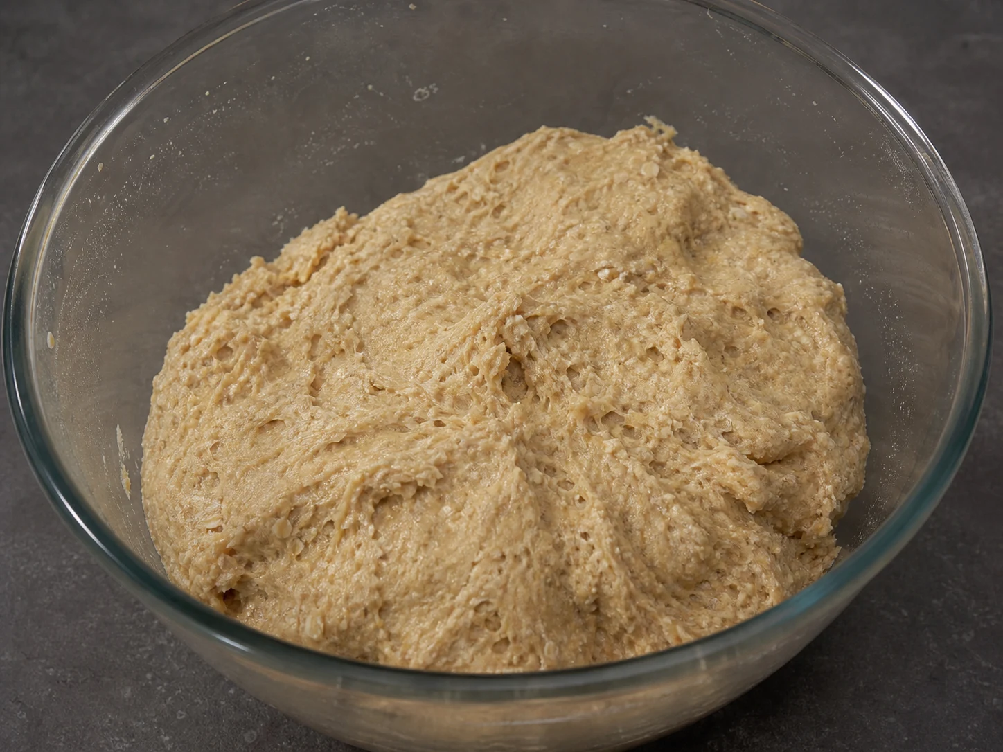 Warm Scottish oatcake dough mixed until firm and slightly tacky in a heatproof bowl