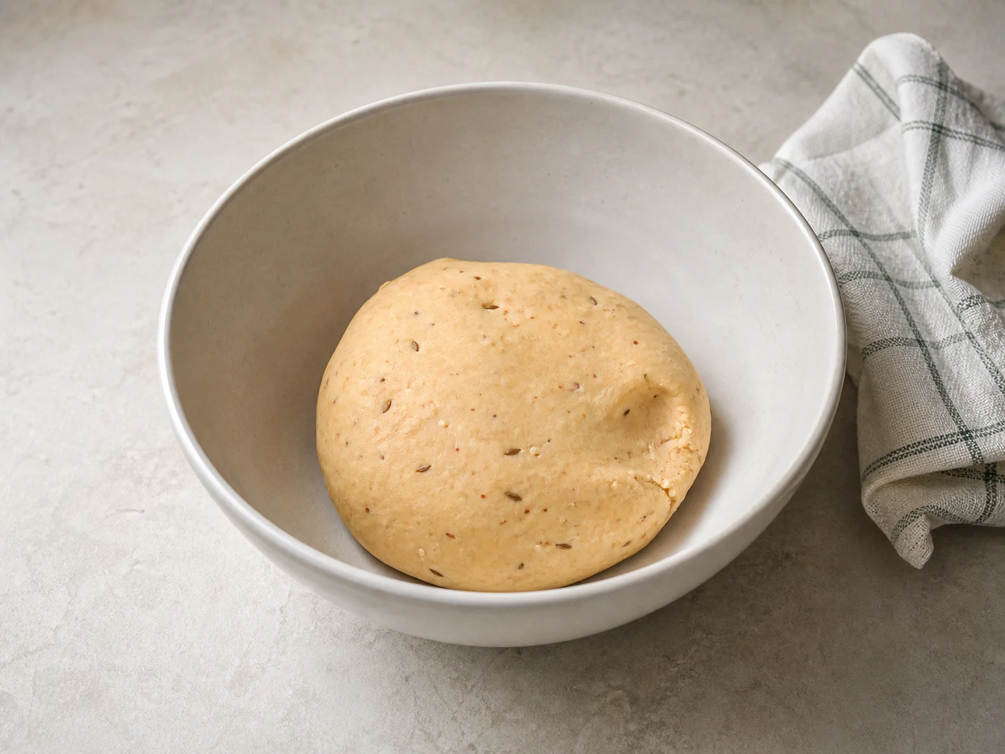Smooth soft non-sticky murukku dough with a pinched edge showing no dry cracks