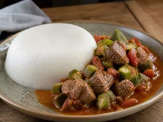 Zimbabwean sadza served with tender beef and okra stew